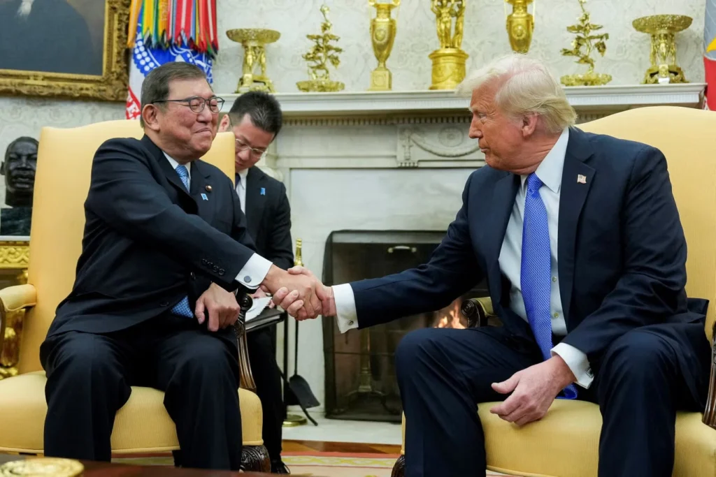 President Donald Trump shakes hands with Japan's Prime Minister Shigeru Ishiba. The president announced a $550 Billion Trade deal with the nation on Tuesday