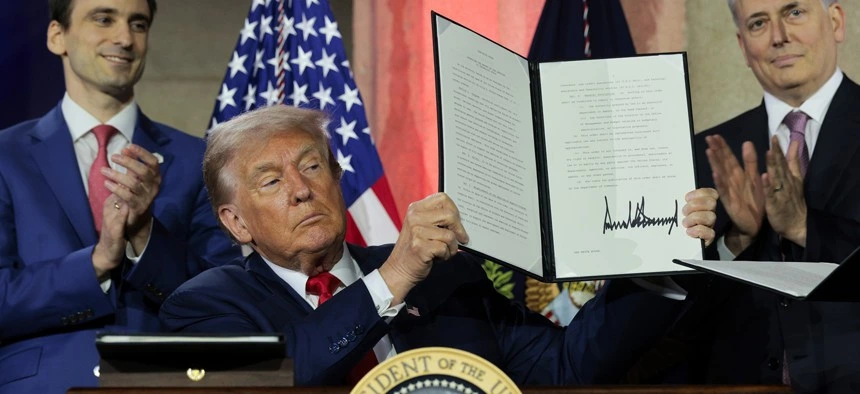 U.S.-president-Donald-Trump-display-signed-order